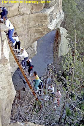 Visitors climbing entrance ladder, Balcony House, Mesa Verde, CO, USA Visitors climbing entrance ladder, Balcony House, Mesa Verde, CO, USA